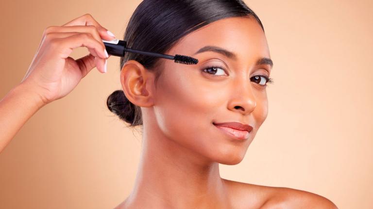 Young woman taking care of her eyebrows